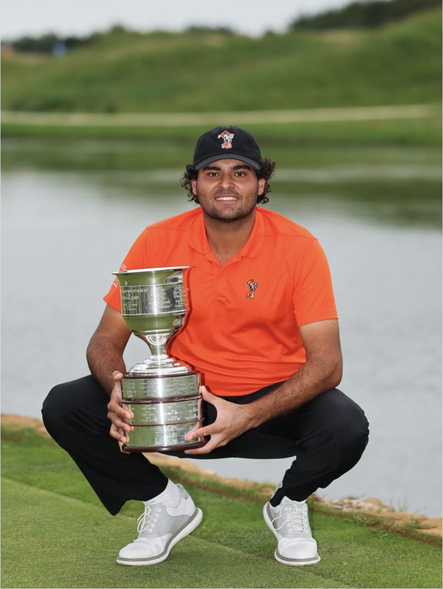 Eugenio Chacarra holding a tournament trophy
