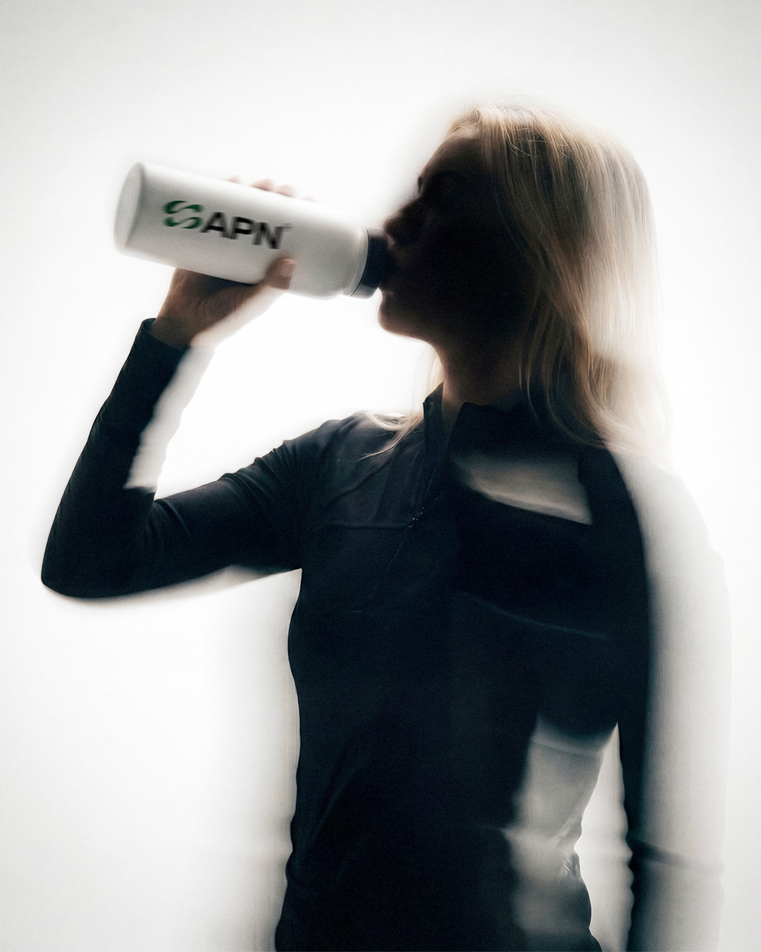 Tournament Starter Bundle — golfer drinking from APN bottle